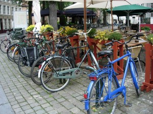 Bruges.BikesAlongCafe